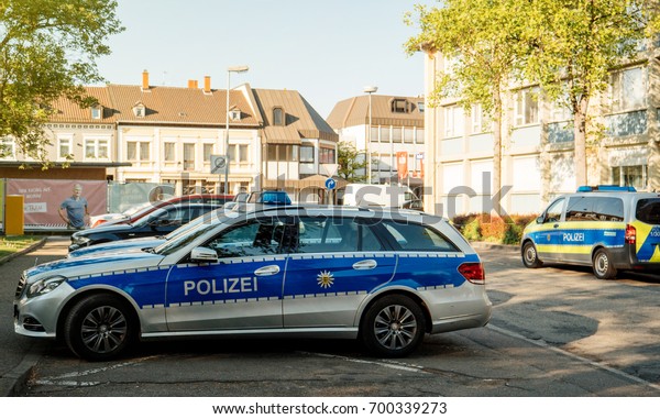 KEHL, GERMANY - APR 28, 201: Modern Polizei\
Police car Mercedes-Benz blue car parked in front of Police Station\
in center of the city of Kehl,\
Germany