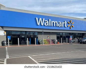 Keizer, Oregon, USA - February 4, 2022: Logo sign over entrance to Walmart store.