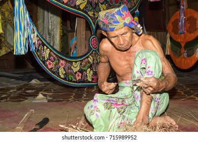 KELANTAN, MALAYSIA - 15 July 2017: Unidentified Man Is Making The Traditional Moon Kite Or Locally Known As 