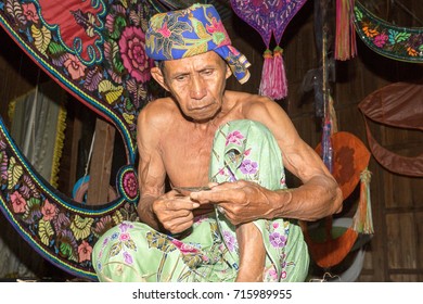 KELANTAN, MALAYSIA - 15 July 2017: Unidentified Man Is Making The Traditional Moon Kite Or Locally Known As 