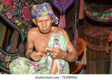 KELANTAN, MALAYSIA - 15 July 2017: Unidentified Man Is Making The Traditional Moon Kite Or Locally Known As 