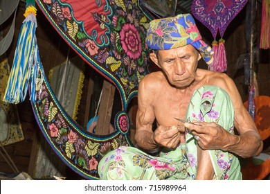 KELANTAN, MALAYSIA - 15 July 2017: Unidentified Man Is Making The Traditional Moon Kite Or Locally Known As 