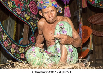 KELANTAN, MALAYSIA - 15 July 2017: Unidentified Man Is Making The Traditional Moon Kite Or Locally Known As 