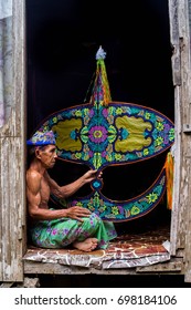 KELANTAN, MALAYSIA - 15TH JULY 2017; Unidentified Man Is Making The Traditional Moon Kite Or Locally Known As 