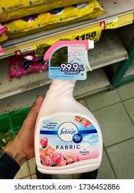 KELANTAN, MALAYSIA - 16 MAY 2020: Hand Hold The New Febreze Fabric Freshener Spray Bottles. Febreze Is A Brand Of Household Odor Eliminator Manufactured By Procter & Gamble