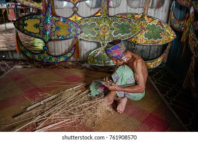 KELANTAN, MALAYSIA - 16TH JULY 2017; Unidentified Man Is Making The Traditional Moon Kite Or Locally Known As 