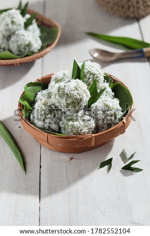 kelepon or klepon or onde-onde made from glutinous rice flour and filled with brownn sugar covered with grated coconut. Some people called this traditional cake from Indonesia as Onde-onde. 