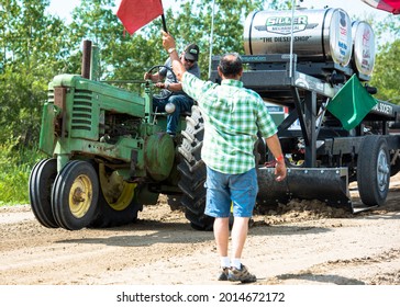 KELVINGTON, CANADA - Aug 06, 2019: A Closeup Shot Of A Classic Tractor Pull With Competition Raising Wheels Off The Ground