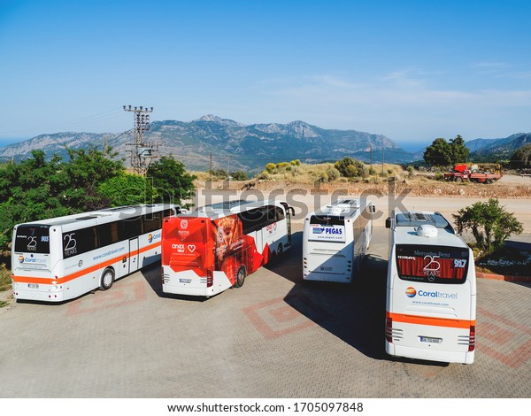 KEMER, TURKEY - May 16, 2018. Touristic buses on\
parking. Coral travel, Anex tour, Pegas travel agency\'s transport\
for tourist excursions. 
