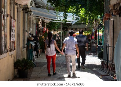 Kemeralti, Konak, Izmir / Turkey - Jul 18th, 2019 - Loving Couple Holding Hands And Walking To A Restaurant In Historical Kemeralti Market In Izmir, Turkey.