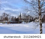 Kemijarvi with Church spire in background with cloudy sky