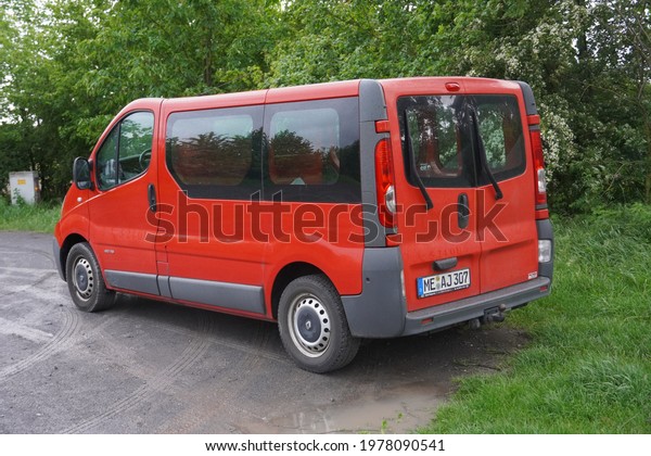 Kempen,Germany-May\
22,2021: Red Renault Trafic second generation is the result after\
joint venture between German Opel, Japanese Nissan, and French\
Renault. Production in\
2001–2014.