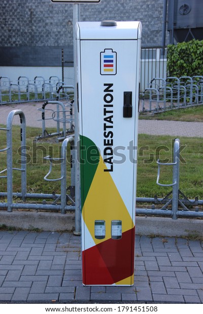 Kempen/NRW/Germany- July\
15,2020 : Vehicles Battery recharge machine installed for\
electronic car to recharge battery, located in Swimming pool\
parking Kempen , Germany\
