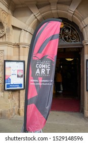  Kendal, Cumbria, UK -October 12, 2019: Advertising Flag Promoting The Lakes International Comic Art Festival Outside Kendal Town Hall                  