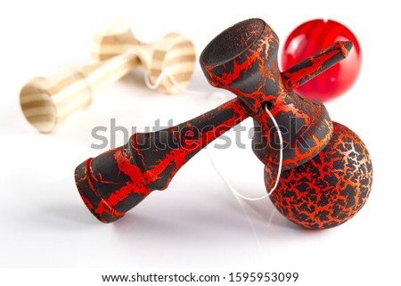 Kendama japanese wooden toy on isolated on white. Wood toy s in black and orange color and traditional bamboo wood