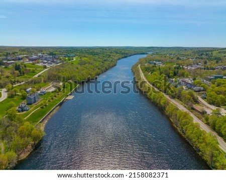 Kennebec River in spring aerial view near historic downtown of Augusta, Maine ME, USA. 