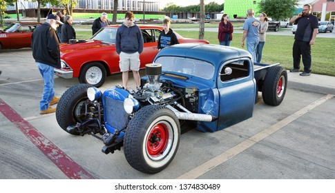 Kennedale,Texas - April 19,2019  Friday Night Classic Car And Hot Rod Show In Kennedale,Texas With People Looking At A Very Low Rider Truck..