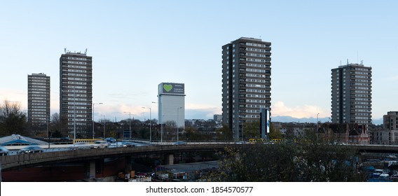 Kensington, London / UK - November 15 2020: Panoramic view of polythene wrapped Grenfell Tower and surrounding buildings, while forensic investigations take place after the fire