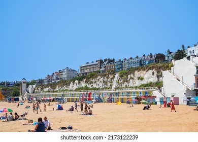 Kent, England - 14 June, 2022 - People enjoying sunshine on the sandy beach at Viking Bay in the seaside town of Broadstairs