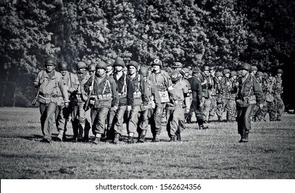 KENT,MILITARY ODYESSY SHOW,ENGLAND-22 AUGUST 2007.WW2 US Army Soldiers And Ww2 German Soldiers March Past The Crowd After Battle Reenactment.