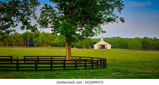 Kentucky Horse Barn With Field In The Foreground.