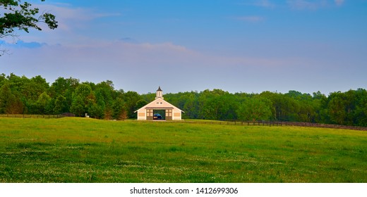 Kentucky Horse Barn With Field In The Foreground.