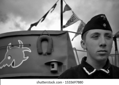 KENT,WAR AND PEACE SHOW,ENGLAND-22nd JULY 2110.WW2 German U Boat Sailor Next To Submarine.