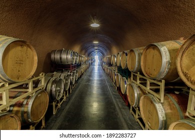 Kenwood, California - April 28, 2019: Cask storage in underground wine cellar in Deerfield Ranch Winery in Sonoma Valley.