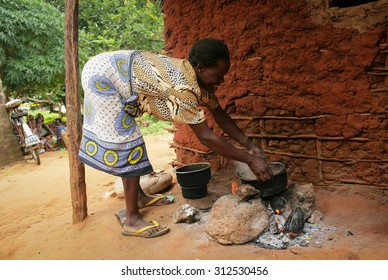 Kenya 2015 Year January 28 .African Kitchen . Black Woman Cooking Dinner