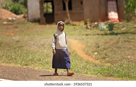 KENYA - February 2021: Local Kenyan School Girl In The Rural Area Of The Country. Poor People Of Kenya