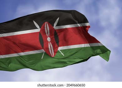 Kenya flag isolated on the blue sky with clipping path. close up waving flag of Kenya. flag symbols of Kenyan.