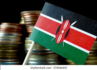 Kenya Flag Waving With Stack Of Money Coins Macro