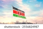 Kenya national flag wavering in beautiful clouds with building skyline. Modern Building skyline with national flag. Kenya national flag for independence day.