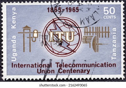 Kenya, Uganda, Tanzania - Circa 1965 : A Stamp Printed In The East African Postal Union Kenya, Uganda, Tanzania Shows ITU Emblem And Old And New Communication Equipment.