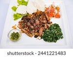 Kenyan cuisine includes ugali, chapati, githeri, goat, Nyama Choma, stews, samosas and sukuma wiki. Ugali is a maize meal, similar to American grits, which is simply cooked in boiling water until it h