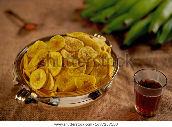 Kerala banana chips recipe with step by step pics.\
Kerala banana chips are crispy and tasty banana chips made with\
unripe nendran bananas and coconut oil. Its the frying in coconut\
oil and the firm te