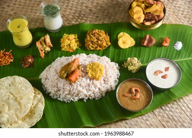 Kerala food for Onam festival special curry for Onam sadya or sadhya in green banana leaf background. Also popular Sri Lankan food . South Indian vegetarian vegan food lunch