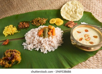 Kerala food for Onam festival special curry for Onam sadya or sadhya in green banana leaf background. Also popular Sri Lankan food . South Indian vegetarian vegan food lunch