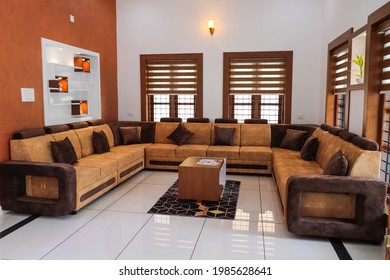 Kerala Indian Stylish interior design of living room with modern mint sofa, wooden console, cube, coffee table, lamp, plant, mock up poster frame, pillows, plaid, decoration