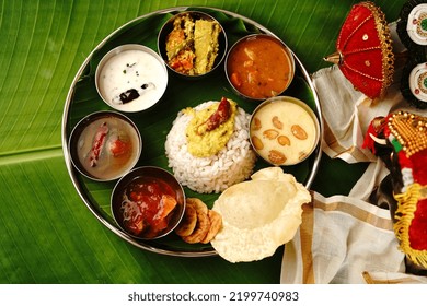 Kerala Ona Sadya Onam Feast - Vegetarian Thali Served On A Round Plate With Banana Leaf