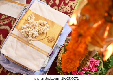 Kerala Saree and ornaments set up for the wedding ceremony for handing over to the bride.
