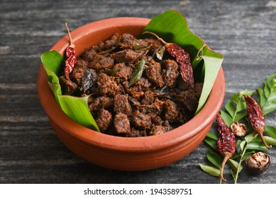 Kerala Style Beef Or Mutton Dry Fry. Delicious Spicy Beef Fry In Clay Pot . Beef Curry For Ghee Rice, Kappa, Appam, Parotta, Puttu, Bread And Chappathi, Roast. Indian Cuisine .