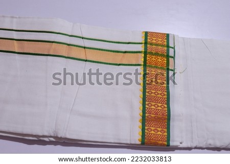 Kerala Traditional Kasavu Dhothi For Groom isolated on White Background