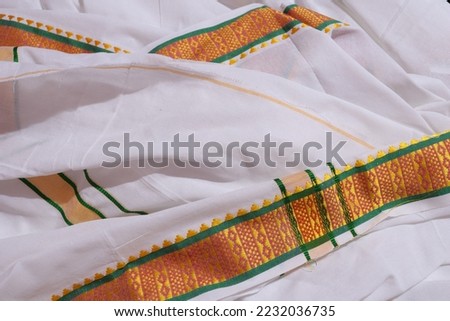 Kerala Traditional Kasavu Dhothi For Groom isolated on White Background