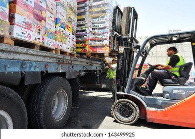 KEREM SHALOM, ISR - JUNE 21 2010: Food Supply Cargo In Kerem Shalom Crossing. The Crossing Used Trucks Carrying Goods From Israel To The Gaza Strip. In 2012, The Rate Of Traffic Was 250 Trucks A Day.