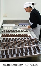 KERIKERI, NZ - JAN 07: Makana Confections Chocolate Factory Worker Prepares Dipped Chocolate Balls On Jan 07 2014.More Than Twice As Many Women Than Men Eat And Crave Chocolate.