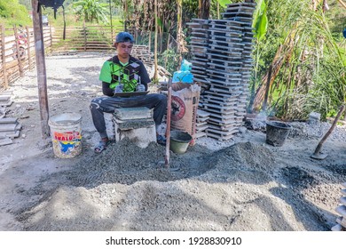 Kerinci, Jambi, Indonesia - 26 October 2020: the process of making bricks manually. Brick is a building material made from a mixture of sand, water, and cement which is compacted in a mold.