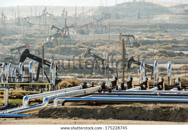 KERN COUNTY, CALIFORNIA - NOVEMBER 26, 2013:\
Pumpjacks extract oil from an oilfield in Kern County, CA. About 15\
billion barrels of oil could be extracted using hydraulic\
fracturing in California.