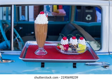 Kernersville North Carolina United States August 13, 2022 A Car Food Tray Attachment With A Milkshake And A Banana Split