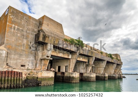 The Keroman Submarine Base structure K3, a WWII German U-boat facility, in Lorient, France, in summer with a beautiful cloudscape